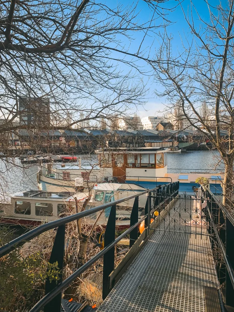 Charming Amsterdam Canal with Boats and Bridge